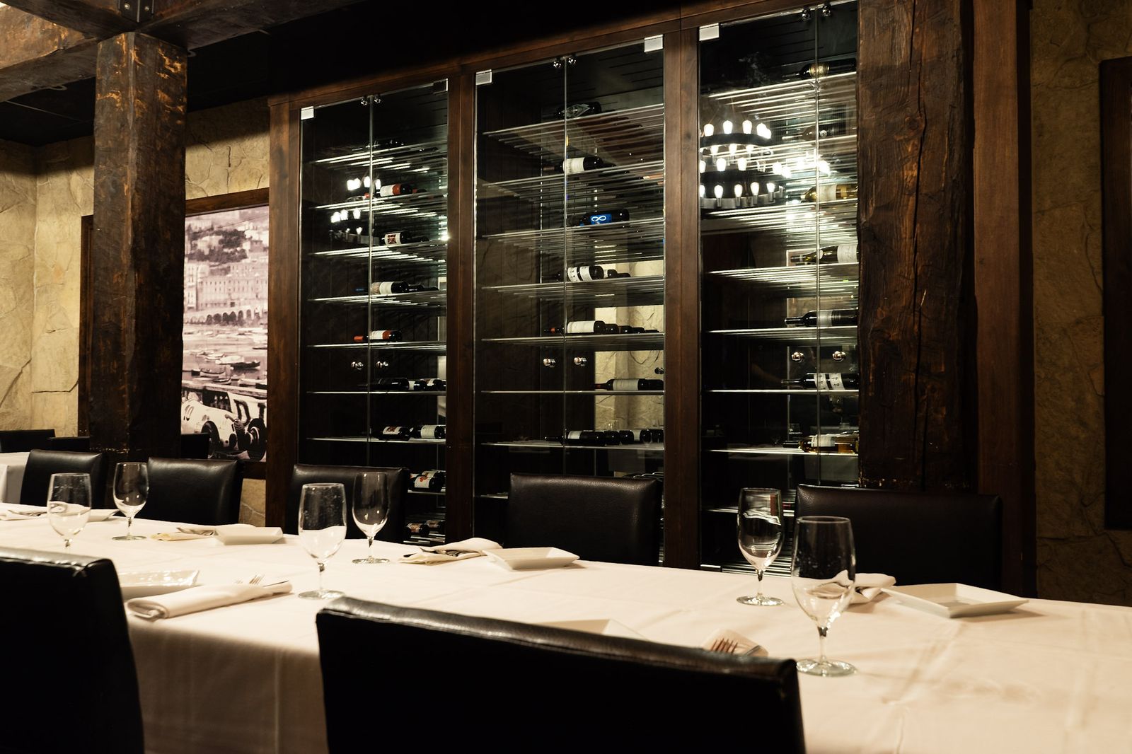 Glass-enclosed wine cellar cabinets in the private dining room